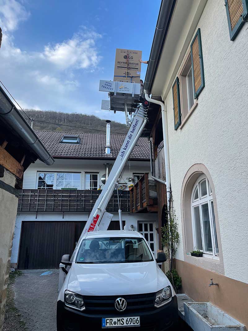 Furniture lift in a narrow alley