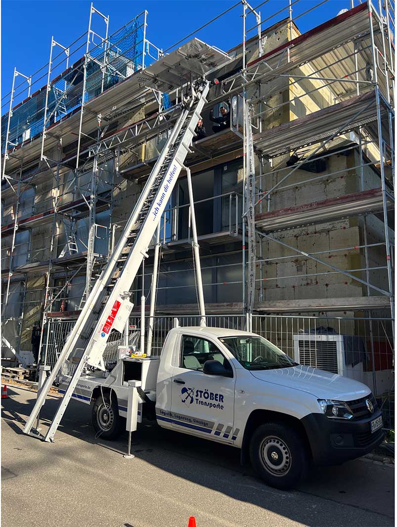 Furniture lift at a building with scaffolding